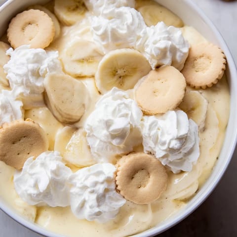 Creamy Southern banana pudding layered with vanilla wafers and ripe bananas, a delightful treat.