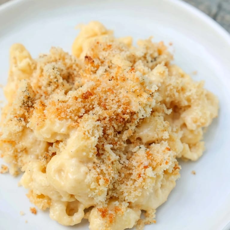 Warm, comforting mac and cheese: a delightful main course perfect for any occasion presented in a baking dish.