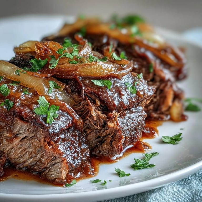 Slow cooker Savory Crock Pot French Onion Pot Roast topped with gooey Gruyere and fresh parsley garnish.